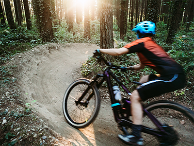 Student riding bike on USA bike trail.